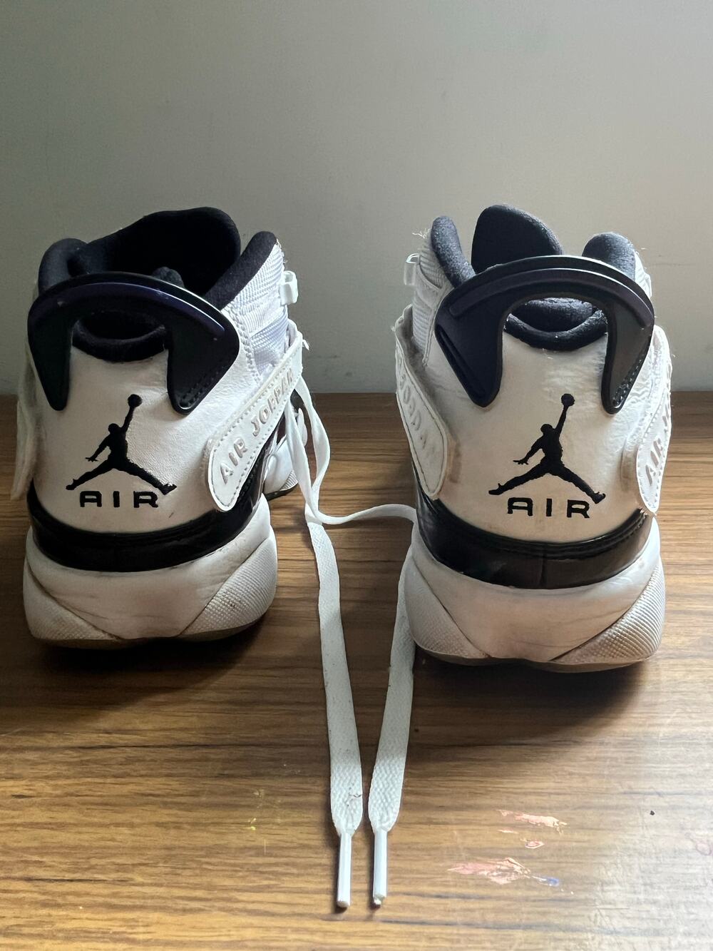 Air Jordan white and black lace-up sneakers with heel strap and Jumpman logo